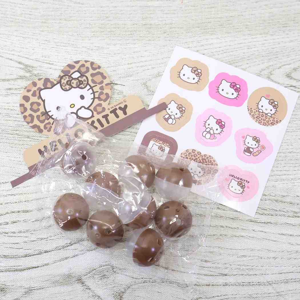 ハローキティ おもちゃ カプセルガチャ ヒョウ柄 サンリオ